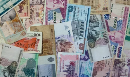 A pile of banknotes from many different countries